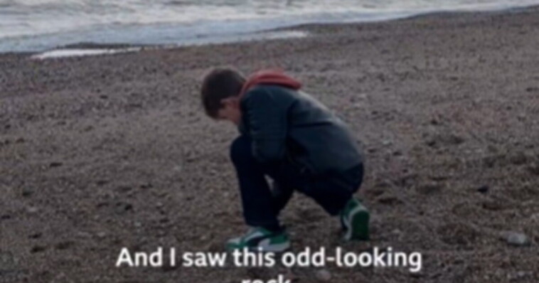 fascinating:-boy-finds-60,000-year-old-axe-on-a-beach-in-england-(video)