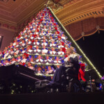 michigan-high-school-choir-performs-holiday-concert-from-67-foot-tall-christmas-tree-shaped-structure