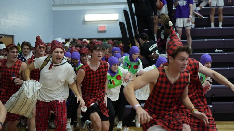 college-basketball-fans-break-silence,-storm-the-court-as-part-of-unique-christmas-tradition