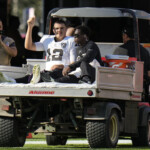 aidan-o’connell-carted-off-with-air-cast-after-late-shove-in-the-back-by-calijah-kancey-injures-raiders-qb