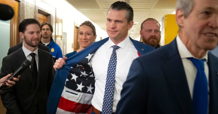 pete-hegseth-shows-reporters-a-patriotic-surprise-hidden-inside-his-suit-coat-as-he-meets-with-senators