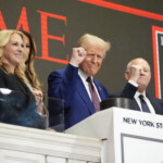 trump-rings-opening-bell-at-nyse-in-front-of-time-‘person-of-the-year’-cover-with-melania-and-daughters-by-his-side