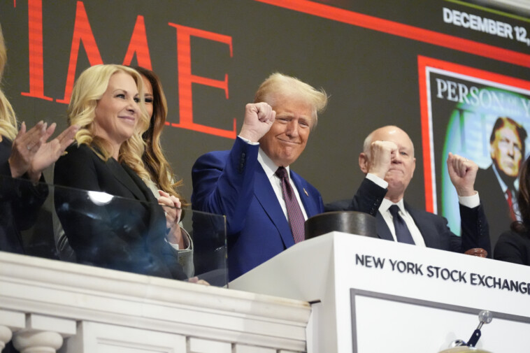 trump-rings-opening-bell-at-nyse-in-front-of-time-‘person-of-the-year’-cover-with-melania-and-daughters-by-his-side