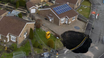 massive-sinkhole-swallows-road,-forces-families-to-evacuate-weeks-before-christmas