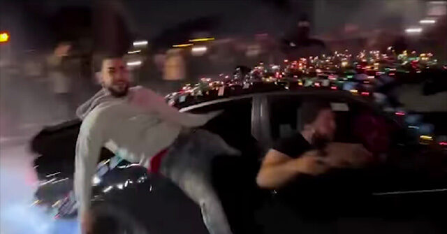 watch-—-‘they’re-idiots’:-mob-performs-fiery-street-takeover-at-florida-intersection