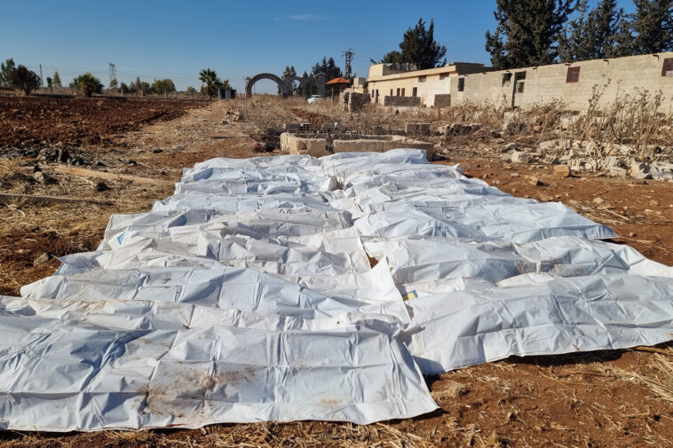 syrian-mass-grave-is-largest-uncovered-since-stalin-era-as-100,000-bodies-were-discarded-outside-damascus:-advocacy-group