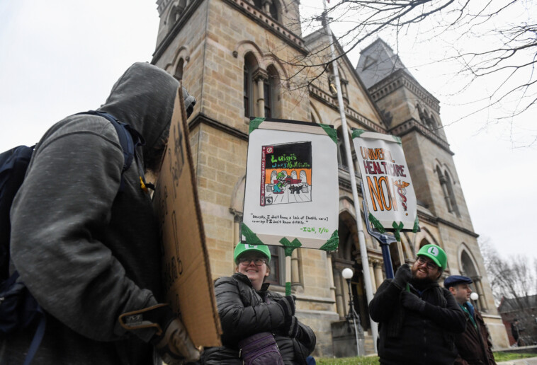 couple-in-‘luigi’-hats-among-dozens-of-twisted-fans-showing-up-outside-courthouses-for-accused-unitedhealthcare-killer-luigi-mangione:-‘i’d-have-another-ceo-killer-on-the-streets-than-another-ceo’