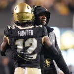 deion-sanders-says-he’ll-‘make-sure’-travis-hunter-plays-offense-and-defense-in-nfl