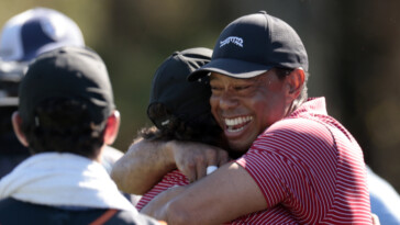 charlie-woods-nails-his-first-hole-in-one,-shares-huge-hug-with-dad-tiger-in-wild-pnc-championship-moment