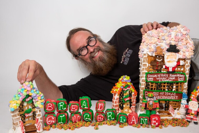 inside-nyc-gingerbread-man’s-massive-big-apple-themed-candy-city-with-hot-dog-stands,-cab-driving-santa-claus