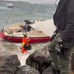 coast-guard-rescues-man-and-his-dog-from-sailboat-run-aground-on-christmas-morning