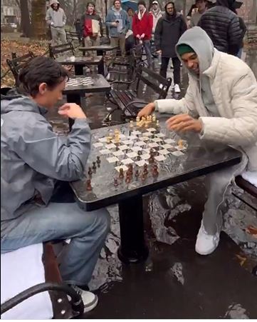 victor-wembanyama-plays-chess-at-washington-square-park-in-rain-after-asking-for-nyc’s-‘best’-spots