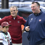 south-carolina-coach-shane-beamer-has-to-be-restrained-after-illinois’-bret-bielema-taunts-usc-sideline-with-substitution-gesture