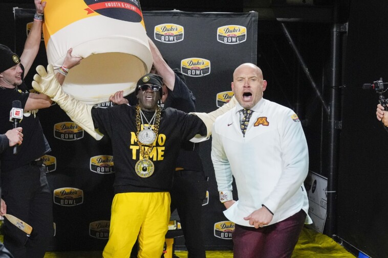 minnesota’s-pj.-fleck-gets-mayo-bath-from-surprise-guest-mascot-flavor-flav-in-surreal-bowl-moment