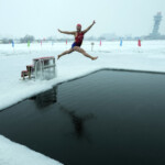 despite-freezing-temperatures,-chinese-swimmers-dive-into-a-river-for-health-and-happiness