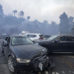 people-abandon-cars-as-they-flee-palisades-fire-in-southern-california