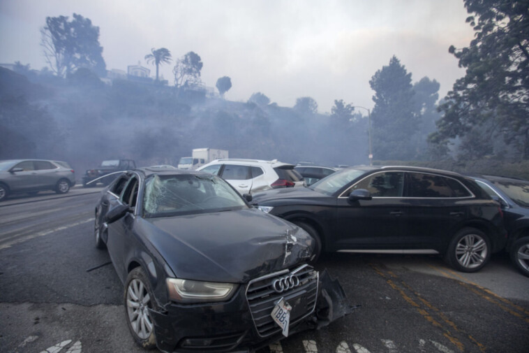 people-abandon-cars-as-they-flee-palisades-fire-in-southern-california