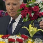 awkward:-mourners-at-jimmy-carter-funeral-place-flowers-on-biden