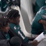 eagles’-aj-brown-caught-reading-motivational-book-on-sideline-during-quiet-playoff-outing