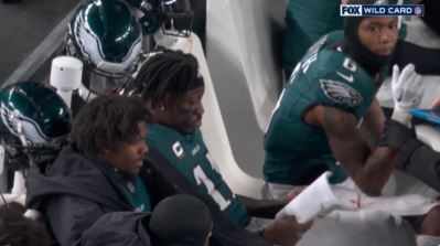 eagles’-aj-brown-caught-reading-motivational-book-on-sideline-during-quiet-playoff-outing