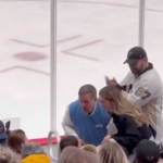 unruly-penguins-fan-steals-puck-from-young-supporter-in-bizarre-scene