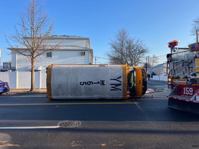 nearly-a-dozen-kids-hurt-as-lexus-slams-into-school-bus,-causing-it-to-flip-in-staten-island:-cops