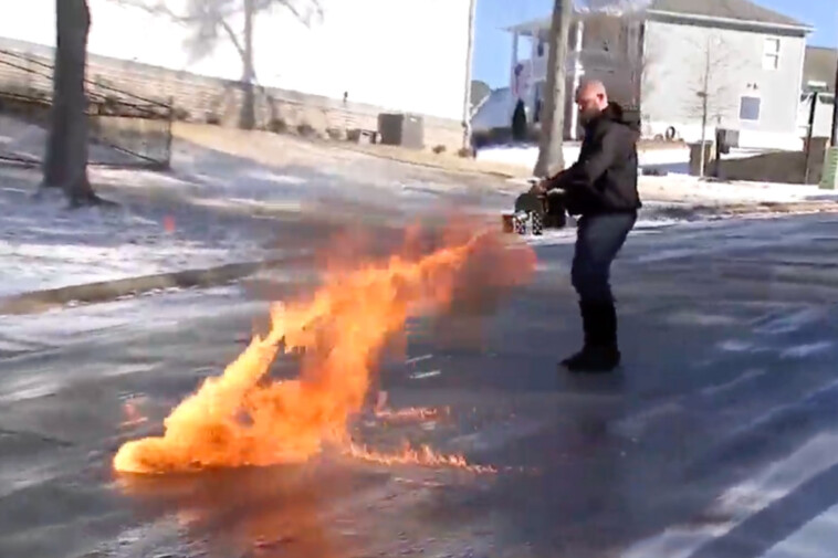 wild-video-shows-man-using-flamethrower-to-defrost-frozen-georgia-street