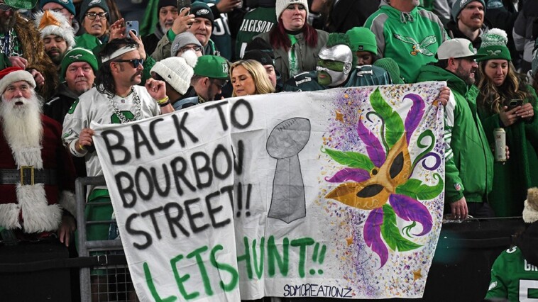 eagles-fans-take-to-streets-to-celebrate-team’s-nfc-title-win;-fan-drops-from-light-pole