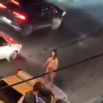 video-shows-naked-iranian-woman-jumping-on-police-car-in-protest-at-country’s-treatment-of-women