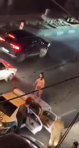 video-shows-naked-iranian-woman-jumping-on-police-car-in-protest-at-country’s-treatment-of-women