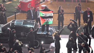 super-bowl-2025-protestor-apprehended-after-invading-halftime-show-with-palestinian,-sudanese-flags