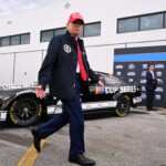 trump-attends-daytona-500,-drives-lap-around-track-in-motorcade-while-delivering-message