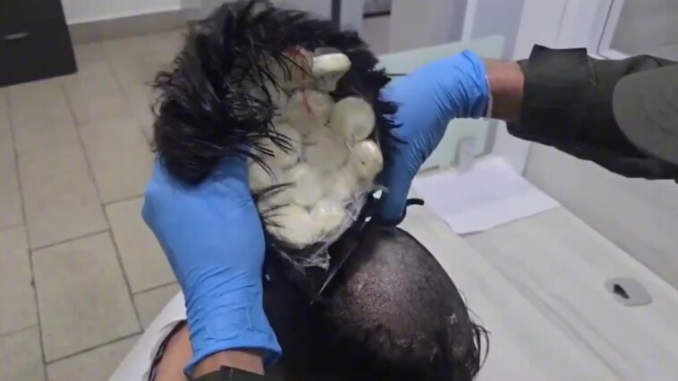 smuggler-caught-trying-to-sneak-$10,000-in-cocaine-onto-plane-under-his-wig