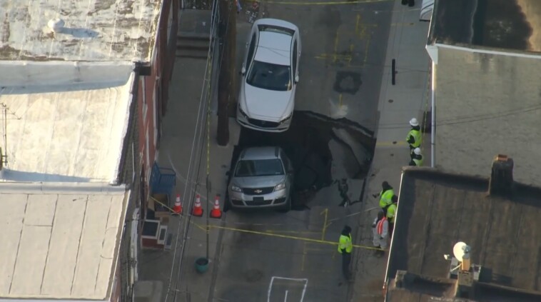 massive-sinkhole-swallows-car-of-police-officer’s-wife-–-but-he-shrugs-it-off-as-‘part-of’-living-in-philadelphia:-‘no-big-deal’