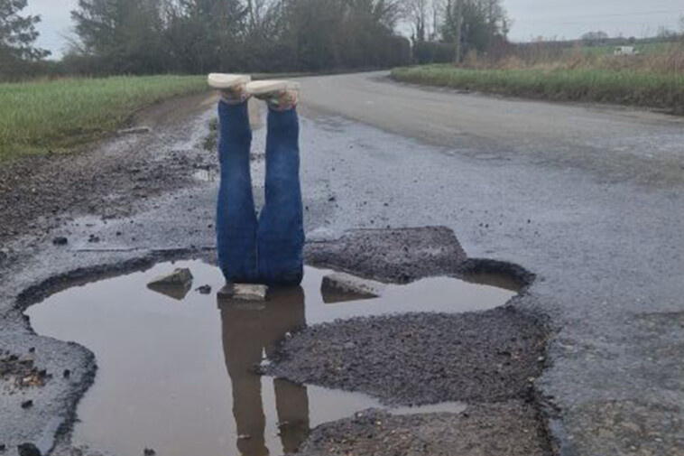 trouble-afoot!-man-fed-up-with-pothole-finally-gets-officials’-attention-with-puddle-diver-prank