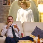 guardian-angel-dutifully-stands-over-man-watching-tv-to-make-sure-he-doesn’t-choke-on-his-pringles