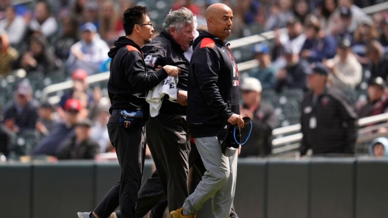 umpire-hit-in-face-by-line-drive,-taken-to-hospital
