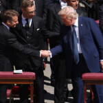 trump,-macron-exchange-firm-handshake-during-‘sign-of-peace’-at-pope-francis’-funeral