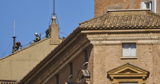 vatican-firefighters-erect-chimney-on-sistine-chapel-for-papal-election