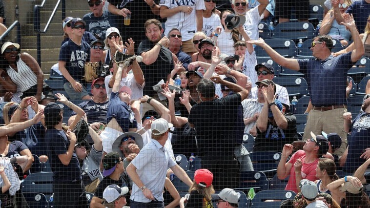 dad-goes-viral-after-catching-ball-at-yankees-game-while-daughter-covers-his-eyes