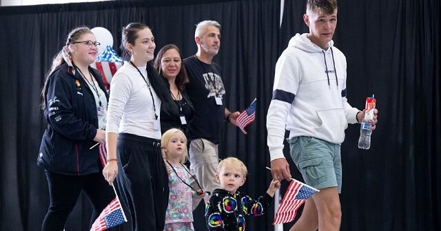 first-white-south-african-refugees-arrive-in-us.,-welcomed-by-trump-admin