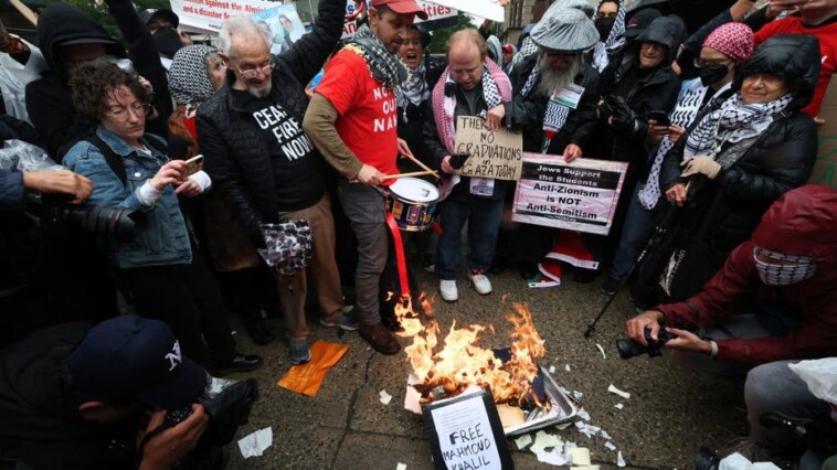 anti-israel-protesters-torch-diplomas-outside-columbia-university-on-graduation-day