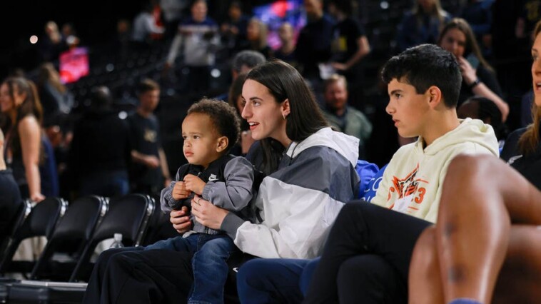 caitlin-clark-seen-carrying-a-baby-at-indiana-fever-game-amid-injury-absence