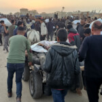 at-least-21-palestinians-killed-while-heading-to-gaza-aid-hub,-hospital-says