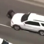 watch:-anti-ice-protester-in-la-partially-run-over-while-blocking-moving-ice-vehicle