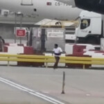 wild-video-shows-mystery-figure-being-chased-on-major-airport-runway-—-steps-from-moving-planes