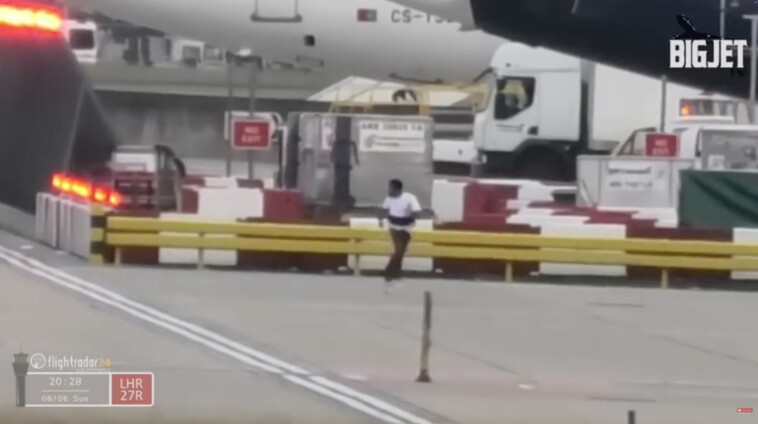 wild-video-shows-mystery-figure-being-chased-on-major-airport-runway-—-steps-from-moving-planes