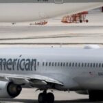 watch:-‘panicking’-travelers-exit-american-airlines-plane-via-slides-due-to-fire-at-denver-airport