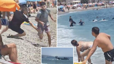 wild-video-shows-sunbathers-tackling-migrants-who-jump-off-boat-at-a-packed-beach-in-spain