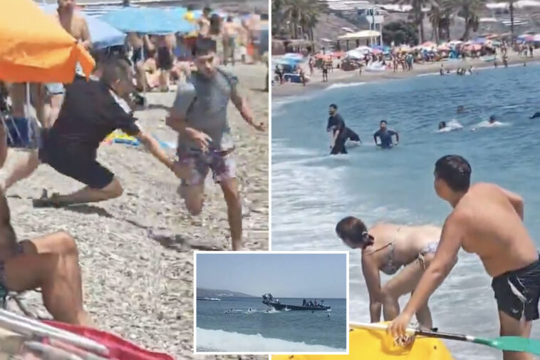 wild-video-shows-sunbathers-tackling-migrants-who-jump-off-boat-at-a-packed-beach-in-spain